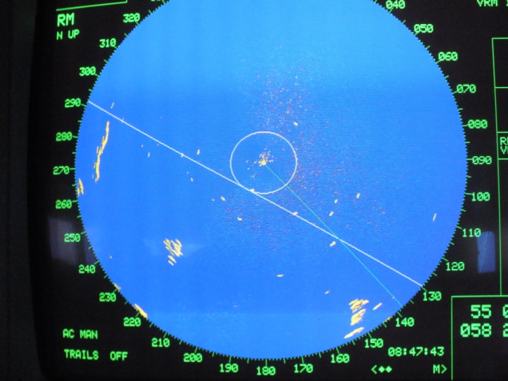 Bright "blips" show icebergs - both individual bergs and rows of them. Our ship is at the centre and the line running from the centre to the SE is our course....between 3 bergs (radius is 6 miles).