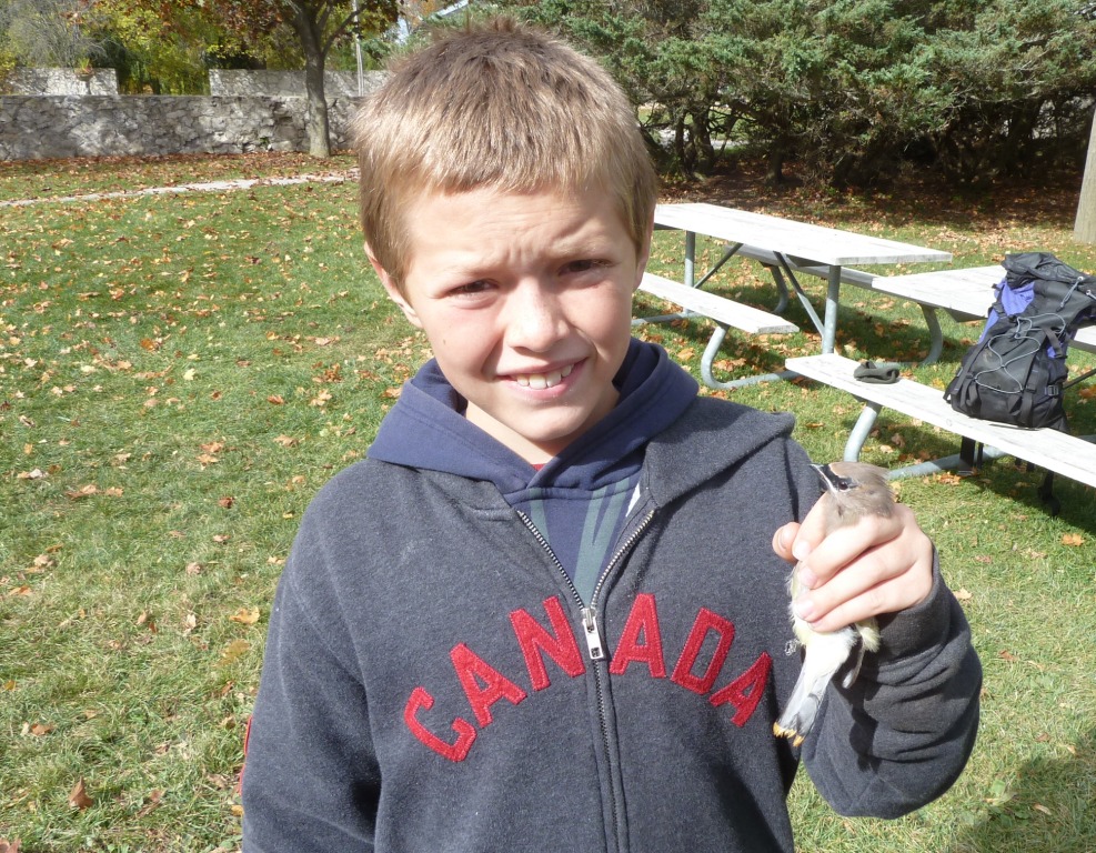Micah with his first banded bird - a Cedar Waxwing.
