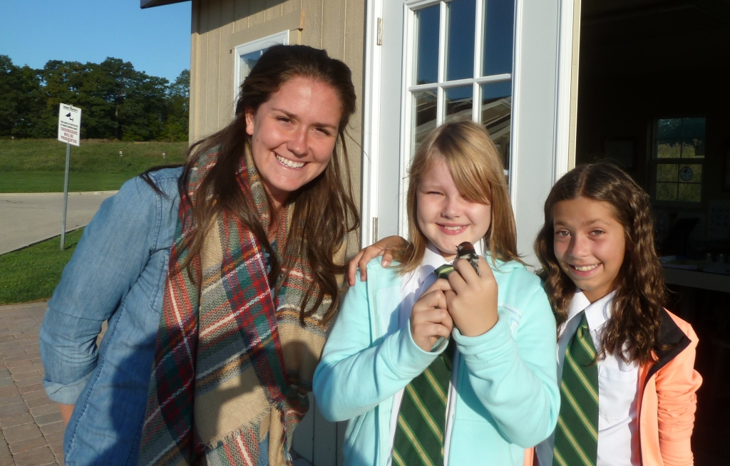 Katherine, Madeline, and Melissa with Madeline's favourite bird (and the first of the Fall season): Downy Woodpecker.